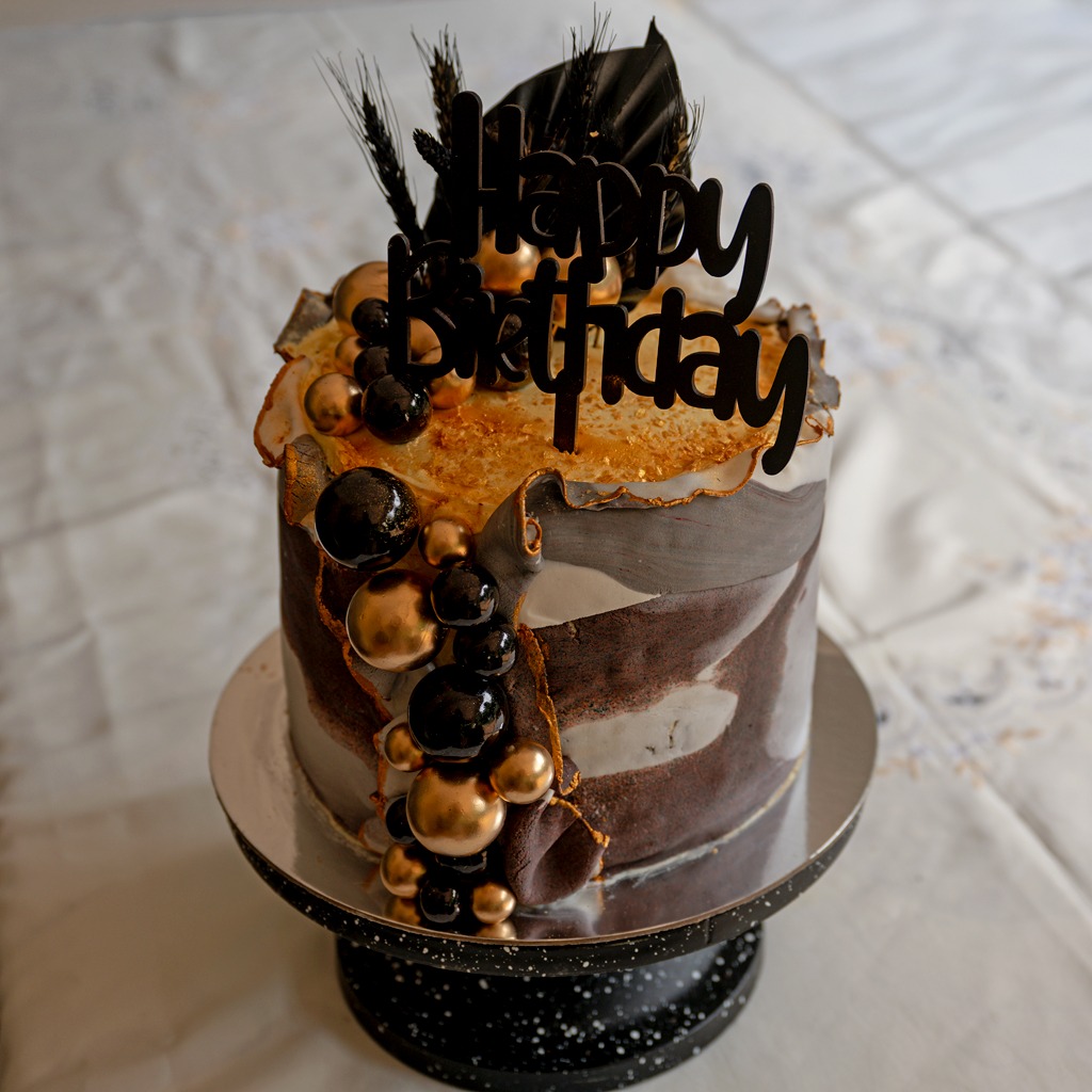 Black and gold marbled birthday cake
