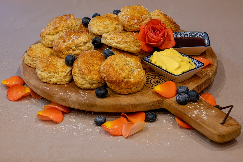 Warm scones served with butter and jam